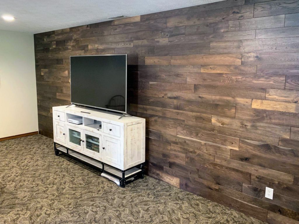 Installing hardwood flooring on shop walls